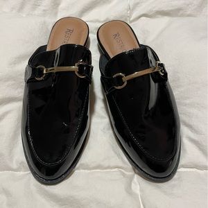 Never worn ladies slip on mules, patent finish with gold tone buckle.